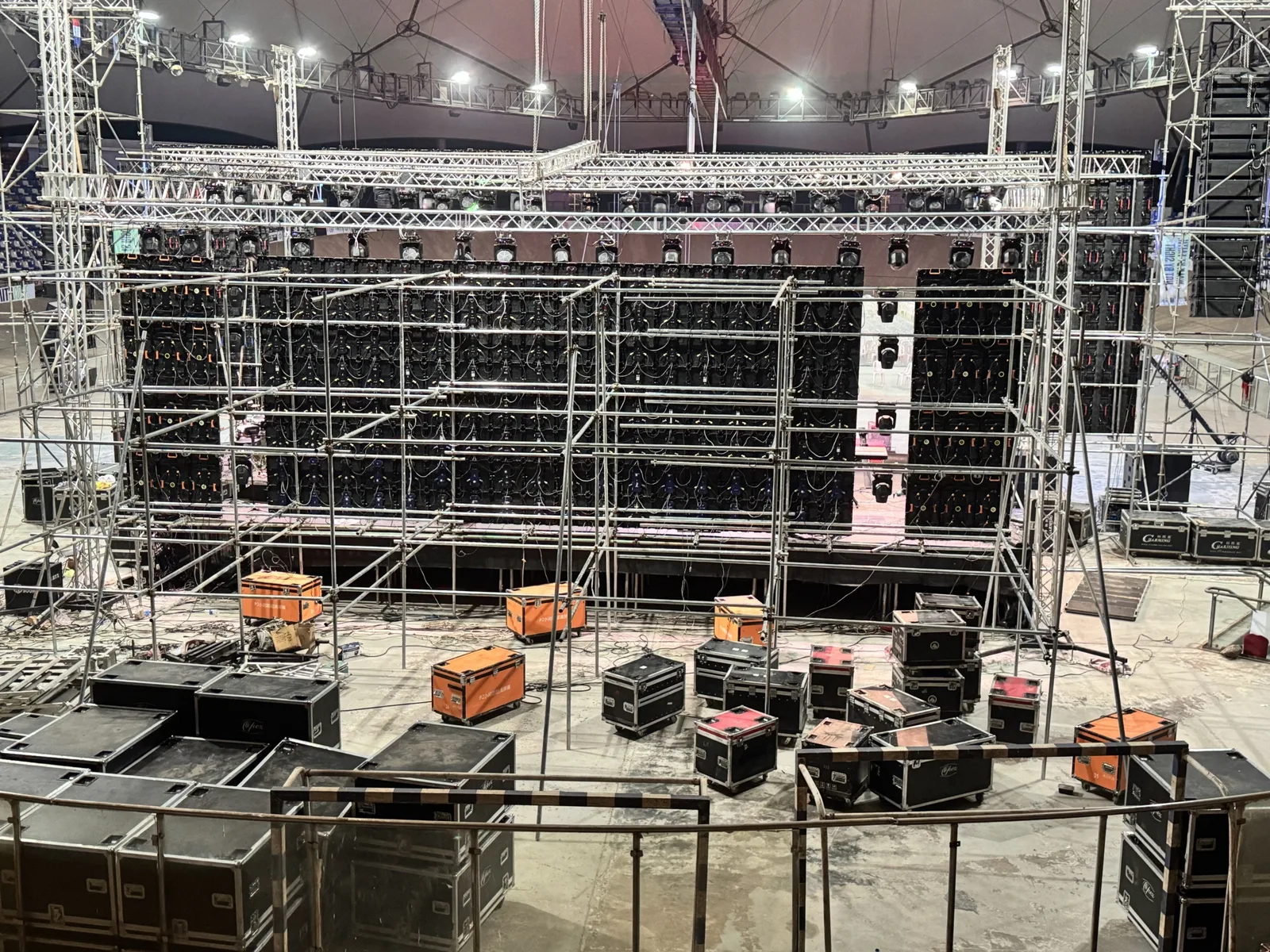 Behind the main wall: every panel's data and power, on scaffold